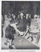 کارگران گروه صنعتی شهریار مقدم مبارک آریامهر را گلباران می کنند